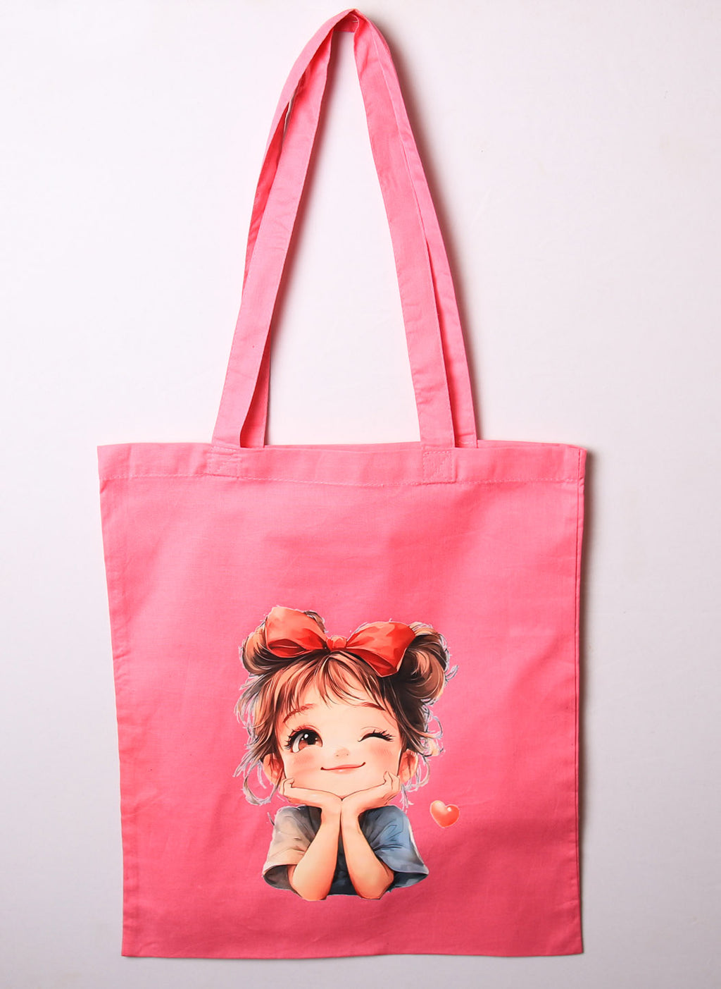 Pink tote bag with cute cartoon girl design