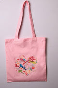 Pink cotton tote bag with floral heart design